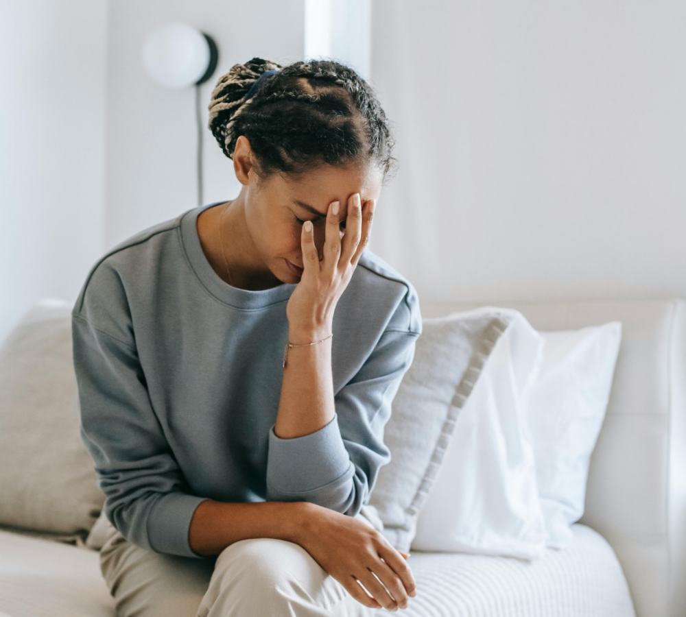 women unsure she is pregnant, looks anxious and unsure what to do next