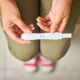 Woman holding pregnancy test